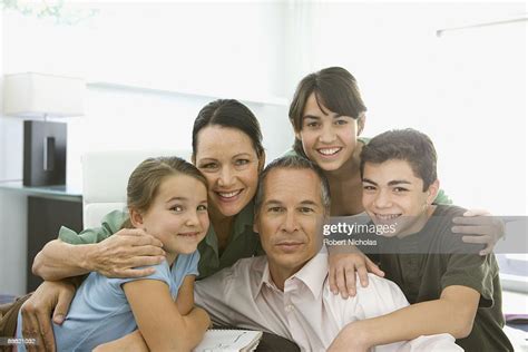 Family Hugging And Smiling High-Res Stock Photo - Getty Images