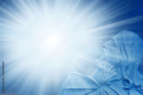 Jesus Christ with divine Light over blue background with rays of light ...