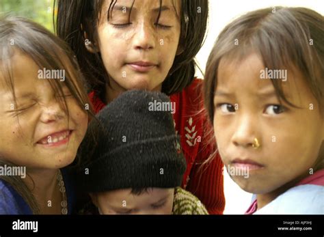 Many happy indian children making funny faces playing outdoors in India ...