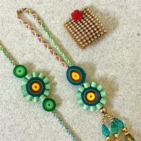 Quilled pair rakhi #crafts2dio | Quilling rakhi, Handmade jewelry ...