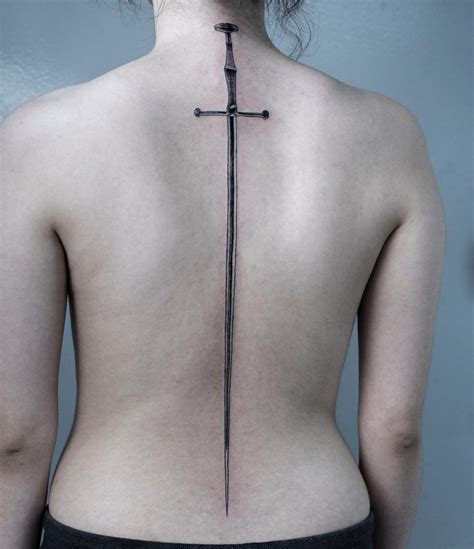 Longsword tattoo over the whole back | Sword tattoo, Sword tattoos for ...