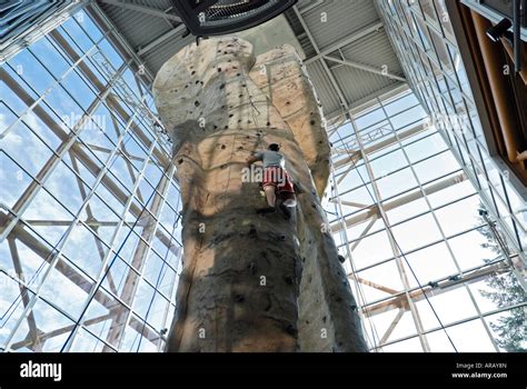 man on climbing wall at REI sporting goods store downtown Seattle ...