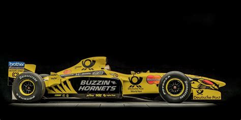 a yellow race car is shown in the dark