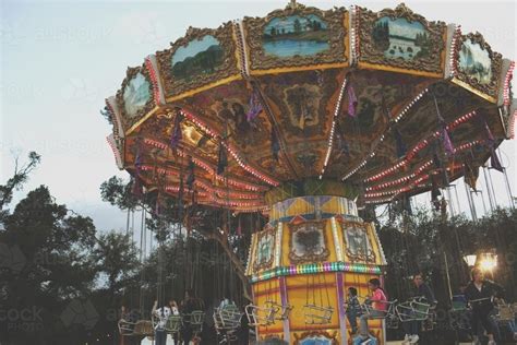 Image of Old fashioned swinging carousel Carnival Ride - Austockphoto