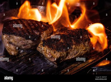 steak on a cast iron griddle Stock Photo - Alamy