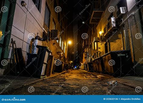 Dark Urban Alleyway with Dim Lights in the City Stock Photo - Image of ...