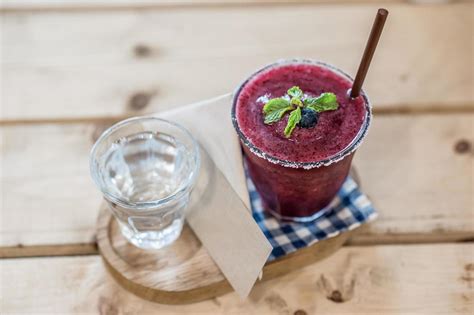 Blueberry smoothie on wooden background 11900347 Stock Photo at Vecteezy