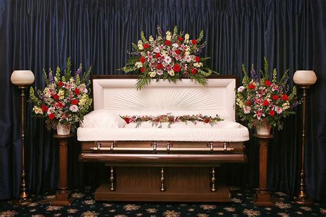 A "full set" of floral designs for an "open casket" service. A "full ...