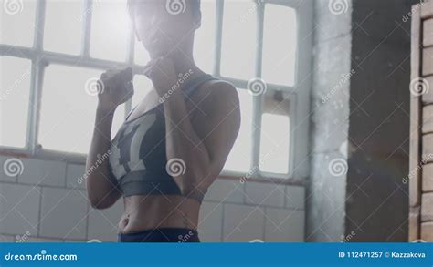 Young Mixed Race African American Woman Makes a Boxing Workout in Sunny ...