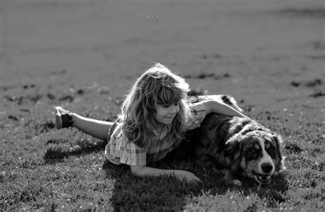 Premium Photo | Child hugging a dog in outdoor kid boy lovingly ...