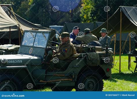 A World War II Reenactment Character Rests in a Jeep Editorial ...