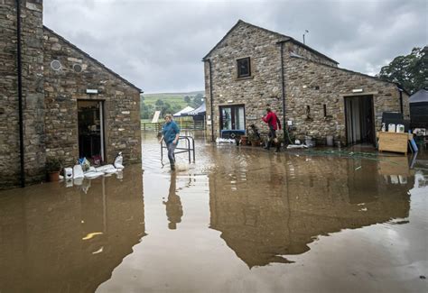 North Yorkshire flooding: pub landlady 'nearly drowns' and bridges ...