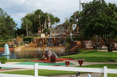 At Pirate's Cove Mini Golf you can putt through caves, over footbridges ...