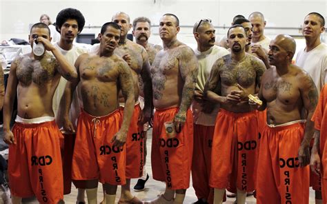 File photo of inmates standing in a gymnasium where they are housed due ...