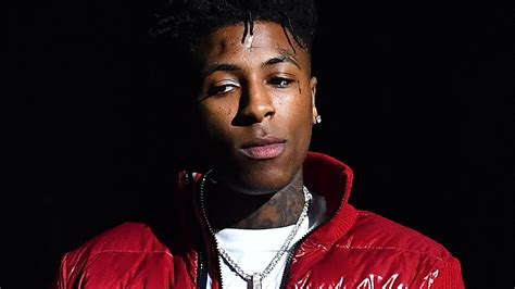 NBA Youngboy Is Wearing White T-Shirt And Red Overcoat Standing In ...