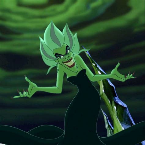 an animated image of a woman in a black dress with green hair and big eyes