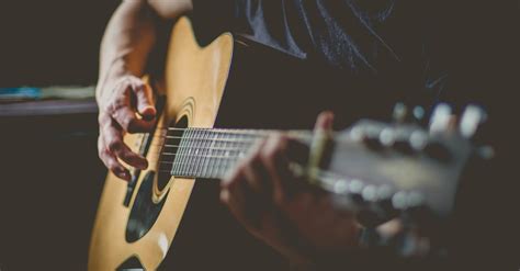 Man Playing An Acoustic Guitar · Free Stock Photo