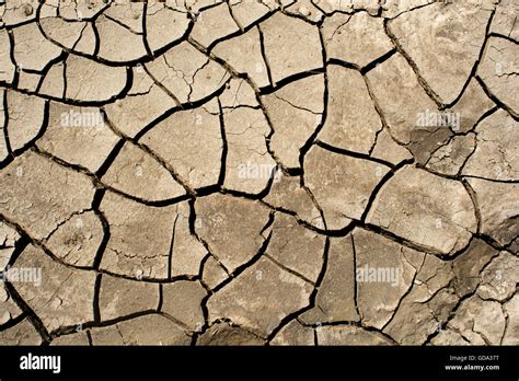 Dry cracked earth background, clay desert texture Stock Photo - Alamy