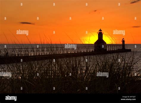 St. Joseph North Pier Lights in St. Joseph, Michigan at sunset Stock ...