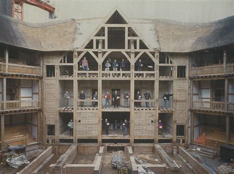 Globe staff and construciton workers stand in the semi-completed ...