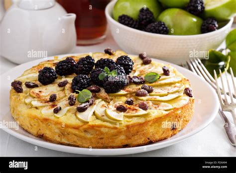 Kugel traditional dish baked pasta pie with apples Stock Photo - Alamy