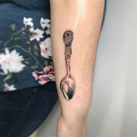 Beautiful intricate spoon tattoo with subtle purple stone... this one ...