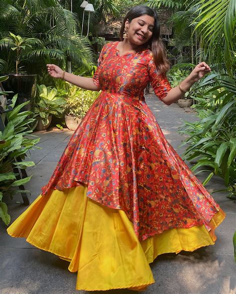 Red and yellow kalamkari silk double layered dress by Athira Designs ...