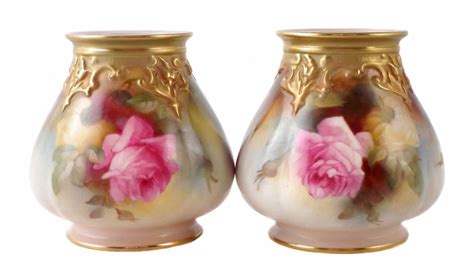 Lot 177 - Two Royal Worcester vases painted with roses.