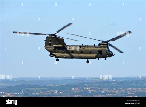 Boeing RAF military Chinook tandem rotor helicopter flying over the ...