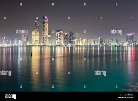 skyline of abu dhabi at night Stock Photo - Alamy