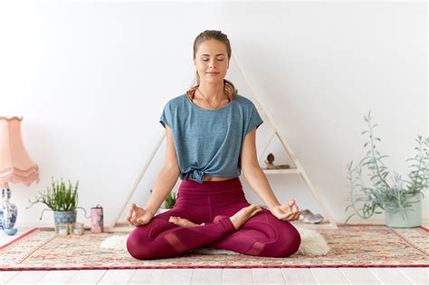 woman meditating in lotus pose at yoga studio – RALPH SMART – INFINITE ...