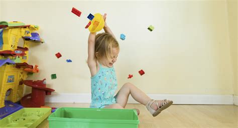 Why your toddler is throwing things and what to do | BabyCenter