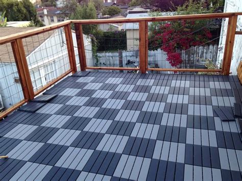 Ikea deck tiles over a flat roof deck. | Deck flooring, Roof deck, Deck ...