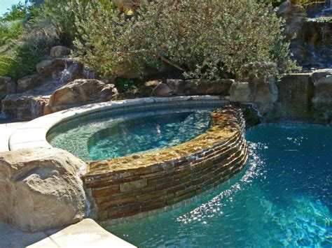 pool waterfall ideas with rustic stone wall