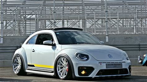 Customized to Impress: White Volkswagen Beetle Dressed in Aftermarket ...