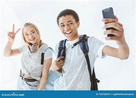 Portrait of Multicultural Teenagers Taking Selfie Together on ...