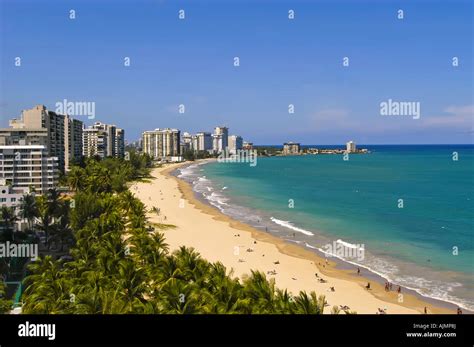 San Juan Puerto Rico Isla Verde beach with sunbathers, blue sky and ...