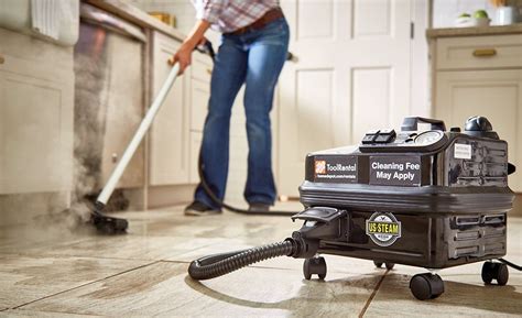 Someone using a steam cleaner to clean grout on a filed floor. Grout ...