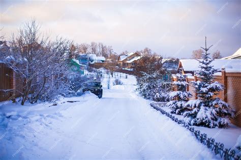 Premium Photo | Winter snowy landscape with houses in a small village