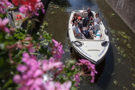 Delft: Open Boat Canal Cruise with Skipper | GetYourGuide