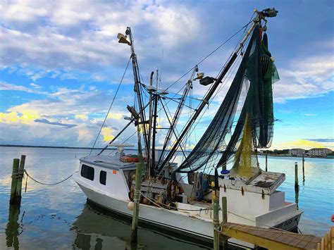 Fishing Boat In Emerald Isle Photograph by Art Spectrum