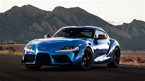 Download Blue Toyota Supra Near Terrains Wallpaper | Wallpapers.com