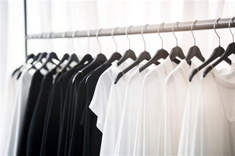 Premium AI Image | White Cotton Clothes Hanging on Black Hangers