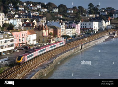 Dawlish seafront with railway line Stock Photo - Alamy