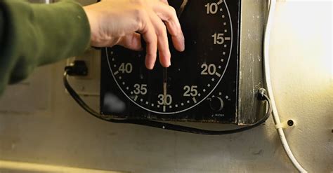 A Person Adjusting the Time of the Clock Free Stock Video Footage ...