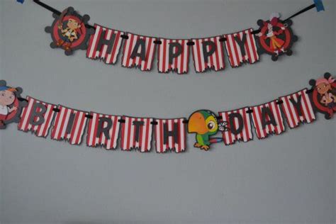 the birthday banner is decorated with cartoon characters