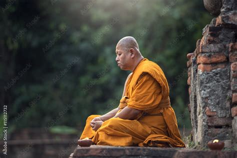 Buddhist monk meditation in temple Stock Photo | Adobe Stock