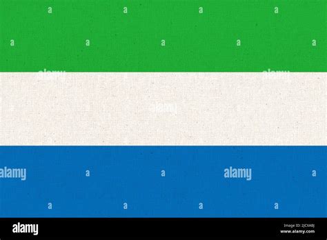 Flag of Sierra Leone. Sierra Leone flag on fabric surface. Fabric ...