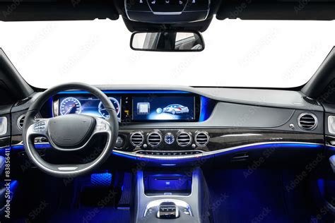 Car interior dashboard black with blue ambient light Photos | Adobe Stock