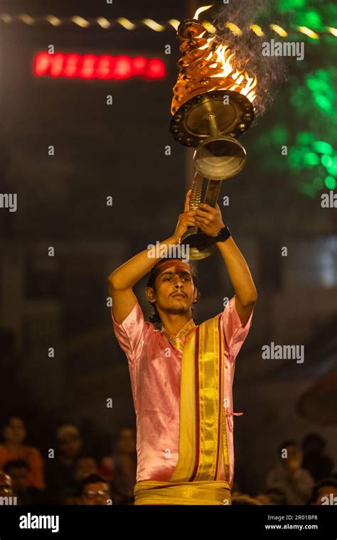 Ganga aarti, Portrait of an young priest performing river ganges ...